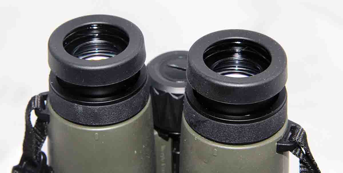 The rangefinding binocular includes click-adjust, rubberized eyecups for use with or without eyeglasses. Dual dioptric adjustment rings serve to separately focus overall view and the OLED display.